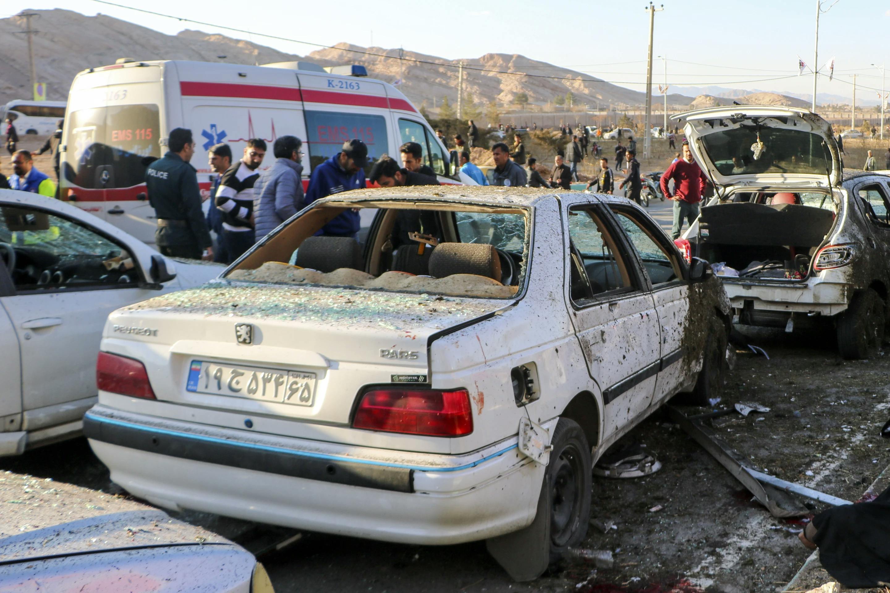 Destroyed cars in Kerman