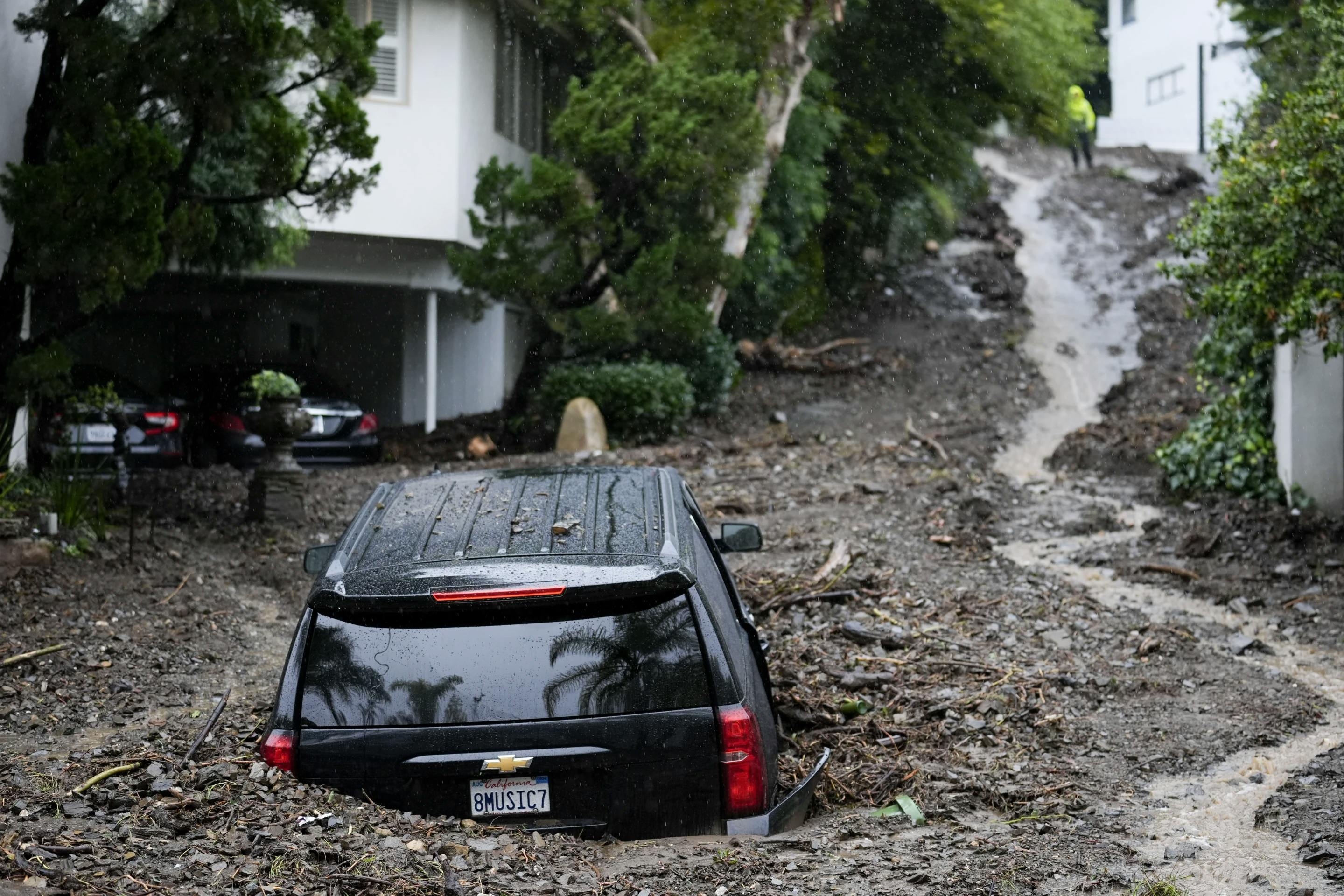 A SUV trapped in a mudslide