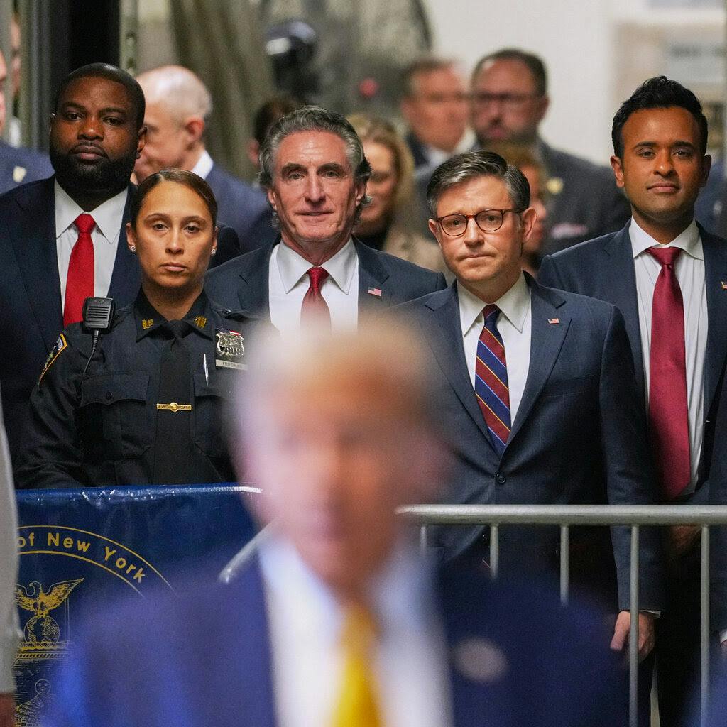 Trump with various Republicans in the background