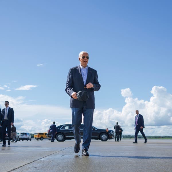 Joe Biden walking on a tarmac