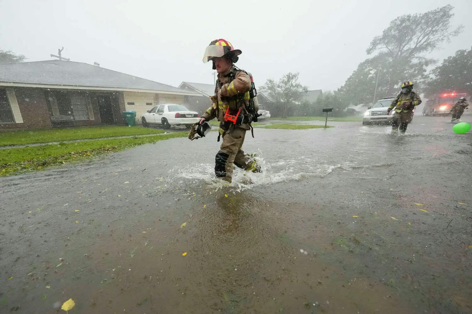 A man wades through water in Louisiana