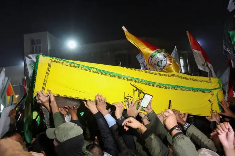 A coffin being carried in Baghdad