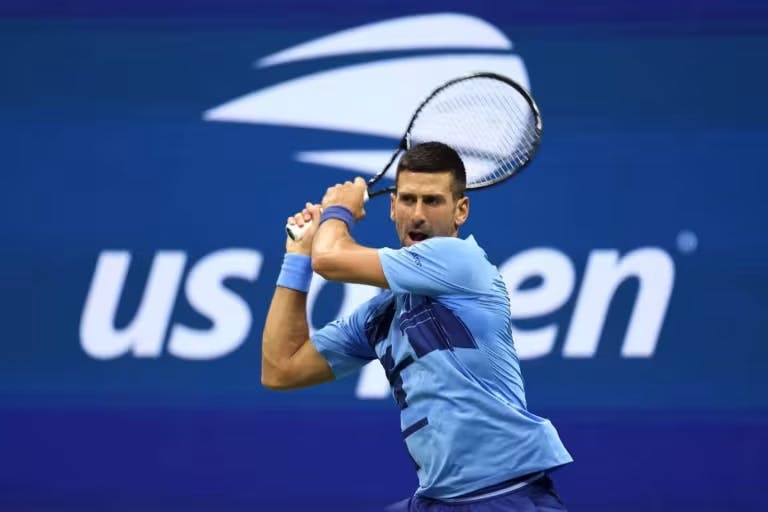 Novak Djokovic hits a backhand