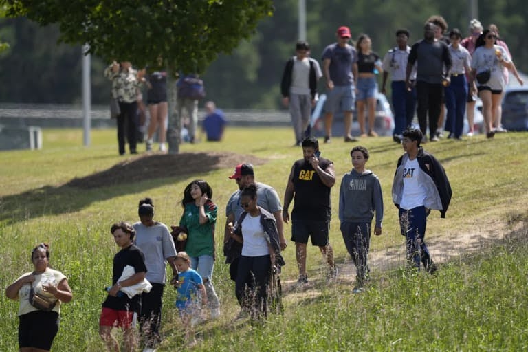 Students walk off a high school campus