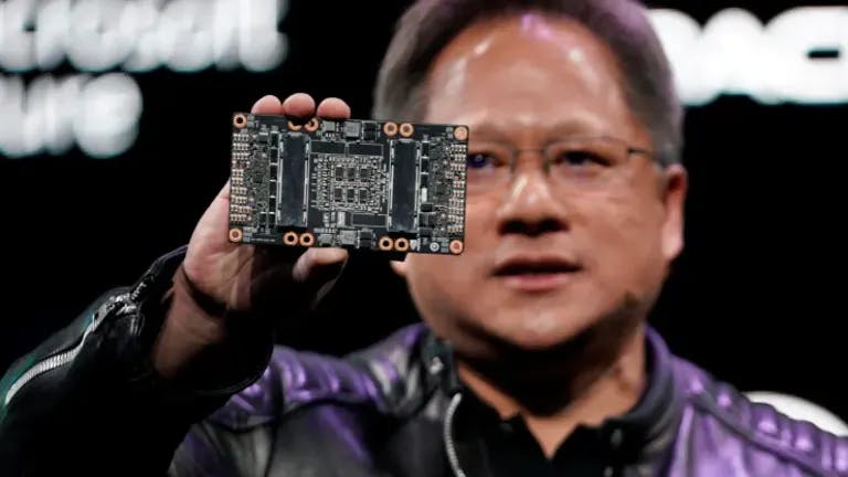 Jensen Huang, CEO of Nvidia, shows the Nvidia Volta GPU computing platform at his keynote address at CES in Las Vegas