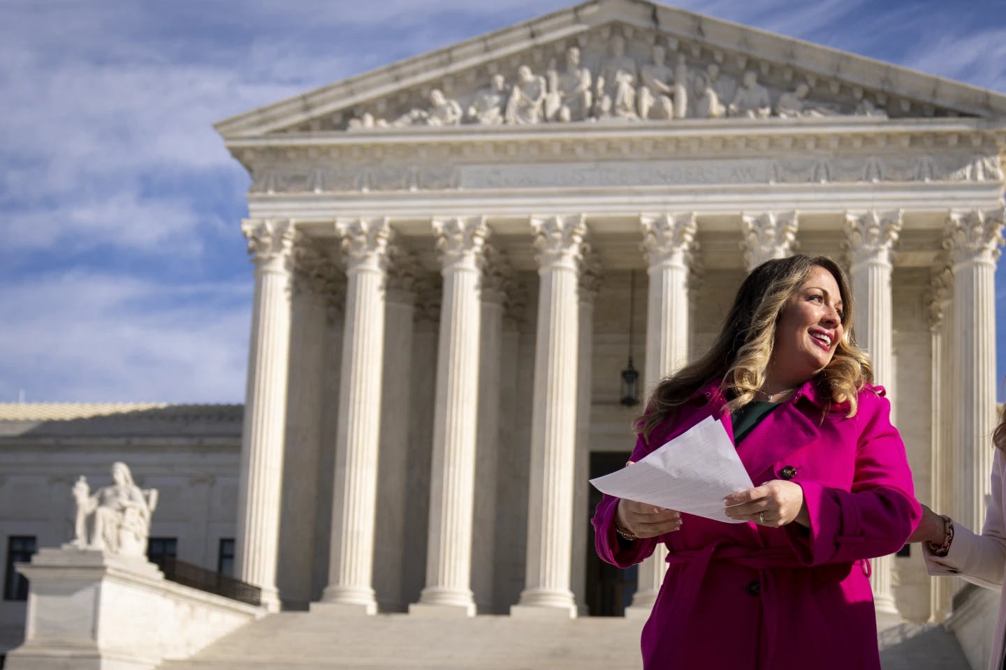 Christian web designer Lorie Smith in front of the Supreme Court