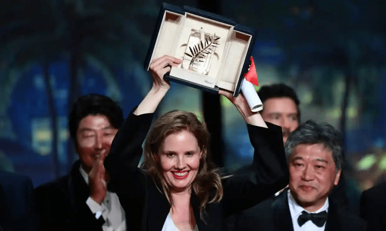 Justine Triet receiving the Palme d’Or
